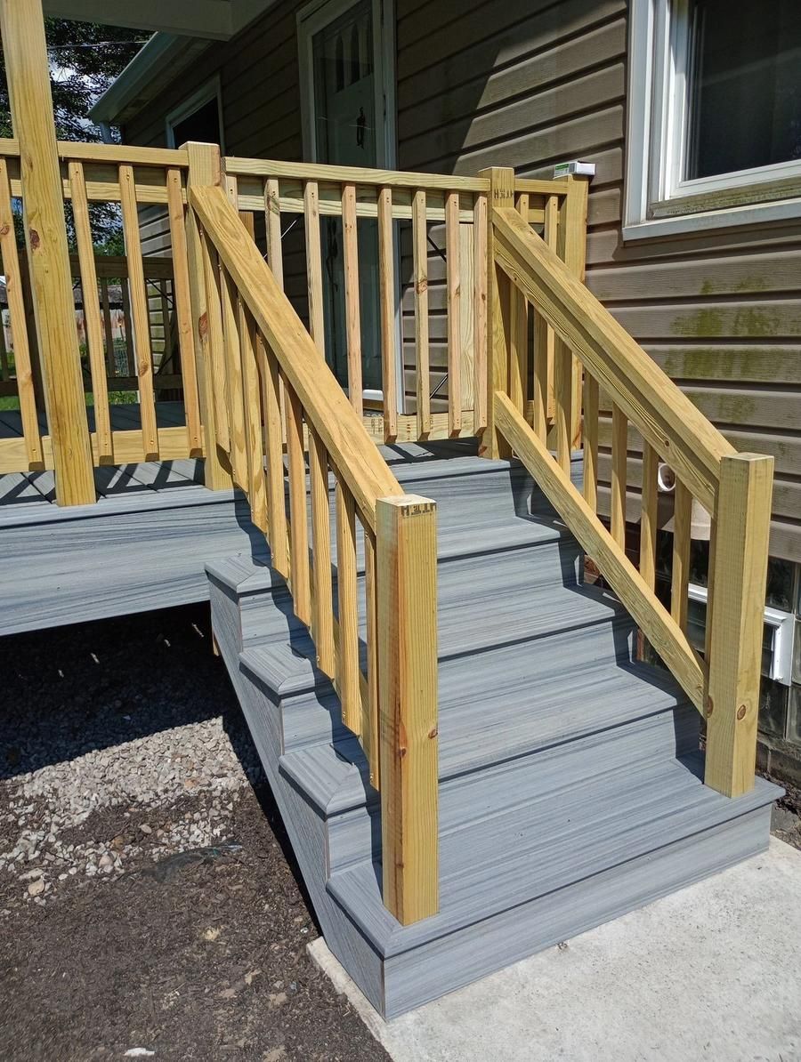 New composite deck stairs with wood railing