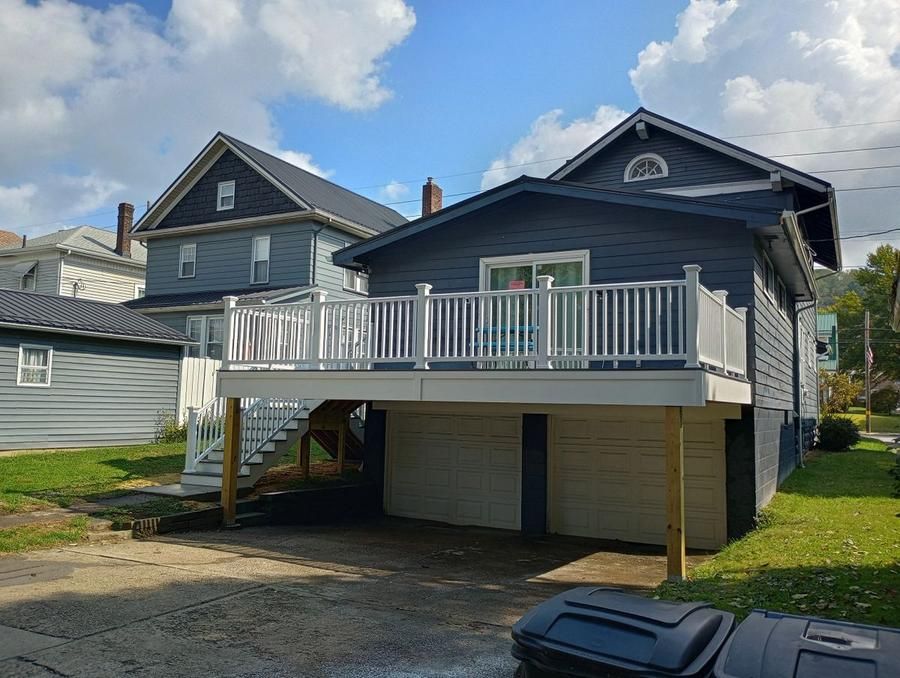 House with elevated deck and garage