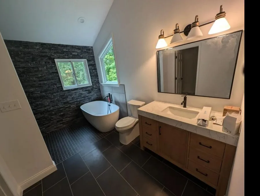 Luxury bathroom remodel with tile work and vanity